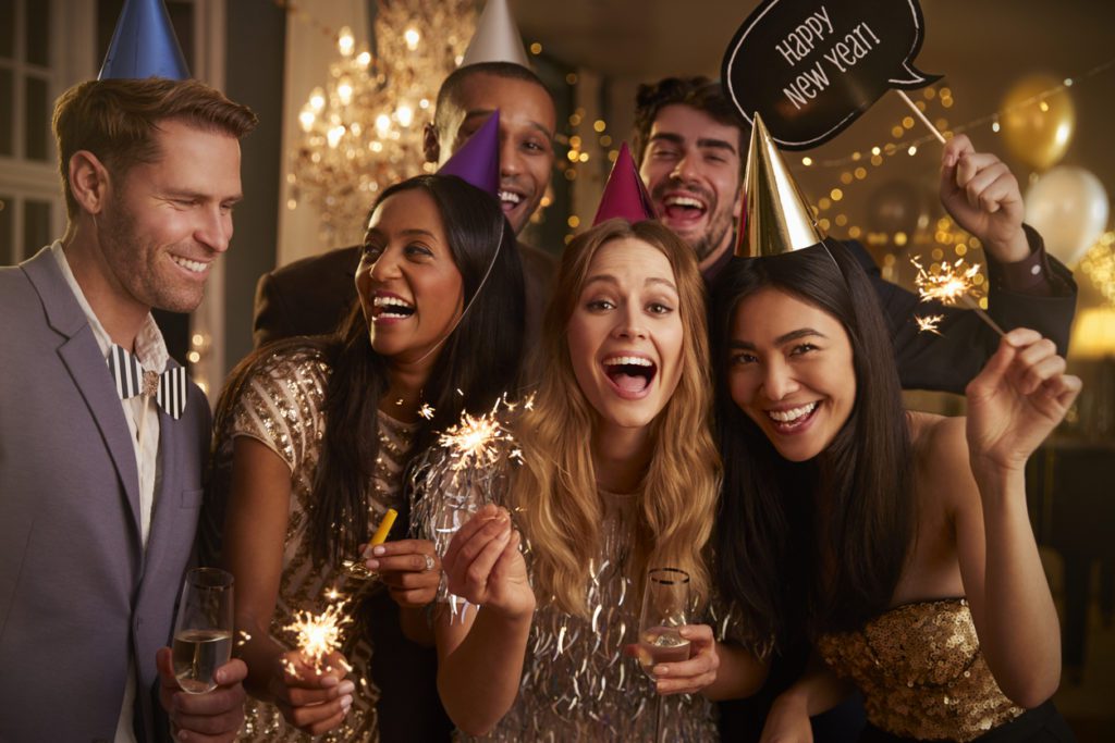 Group Of Friends Celebrating At New Year Party Together