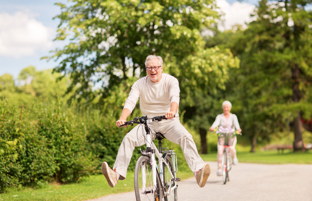 happy old man doing cycling
