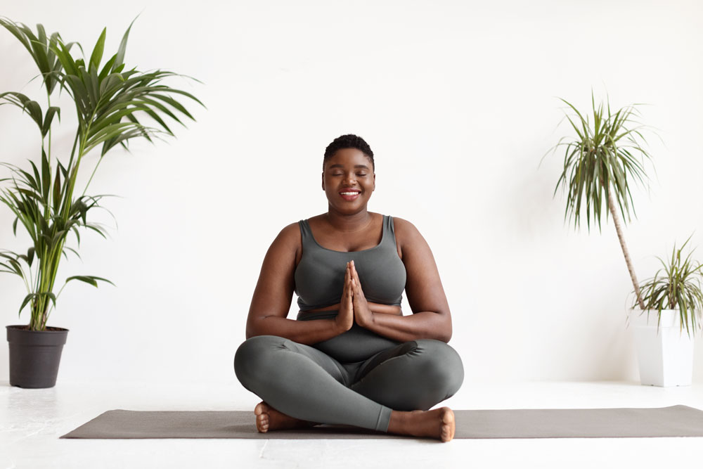 black woman doing meditation