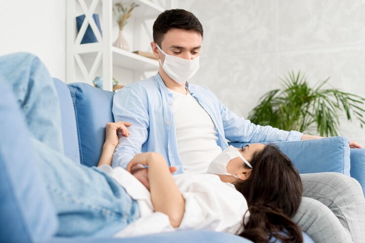 couple-home-couch-with-medical-masks